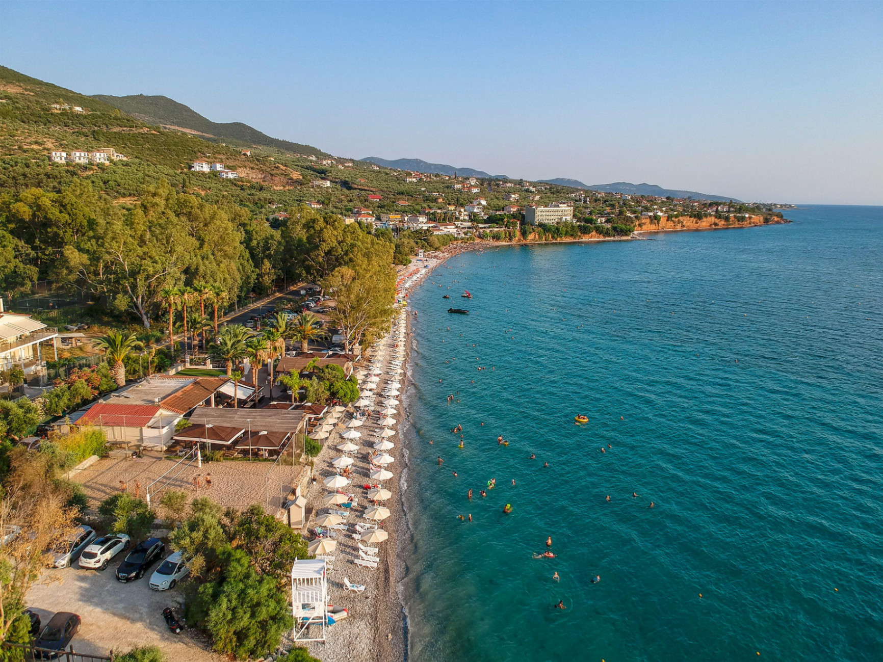 Kalamata beach with rows of umbrellas and turquoise sea