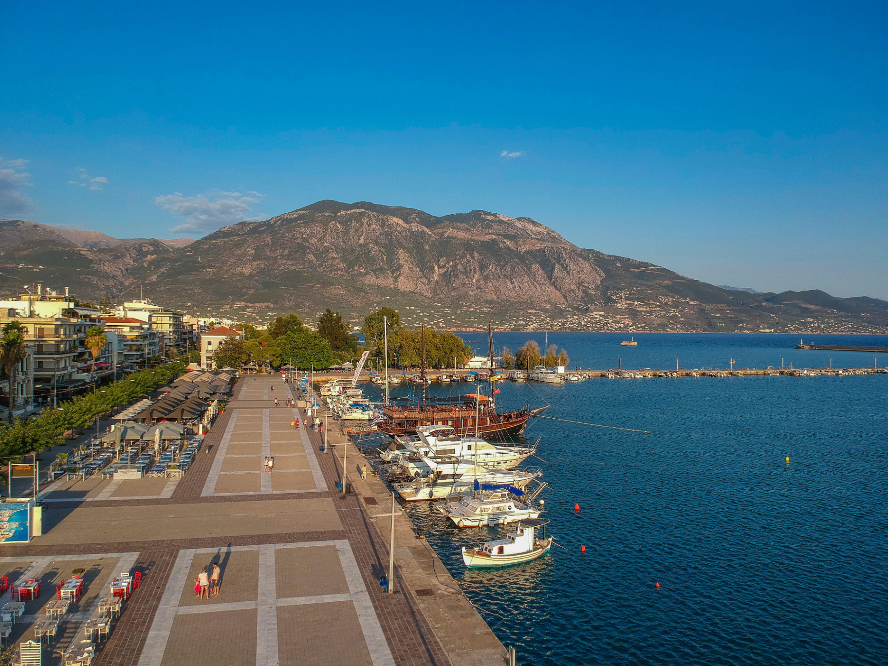 Aerial view of Kalamata Marina promenade with mountains beyond